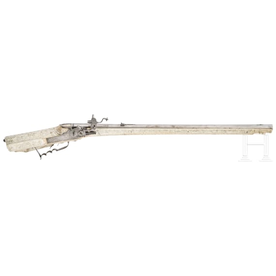 A wheellock hunting rifle with richly engraved, presumably later ivory-veneered stock, Wilhelm Neubauer of Prague, circa 1690/95