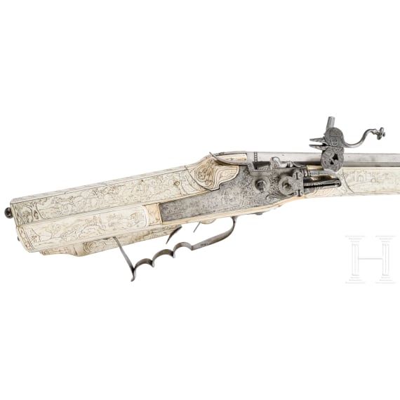 A wheellock hunting rifle with richly engraved, presumably later ivory-veneered stock, Wilhelm Neubauer of Prague, circa 1690/95