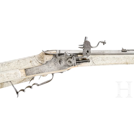 A wheellock hunting rifle with richly engraved, presumably later ivory-veneered stock, Wilhelm Neubauer of Prague, circa 1690/95