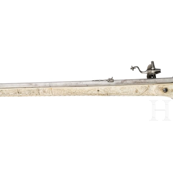 A wheellock hunting rifle with richly engraved, presumably later ivory-veneered stock, Wilhelm Neubauer of Prague, circa 1690/95