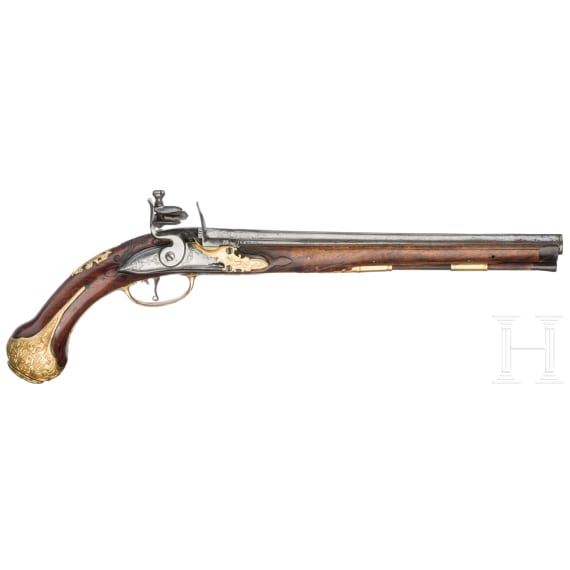 A flintlock pistol with fire-gilt mounts, circa 1720