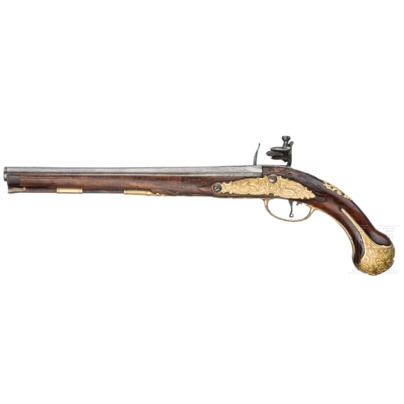 A flintlock pistol with fire-gilt mounts, circa 1720