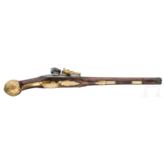 A flintlock pistol with fire-gilt mounts, circa 1720