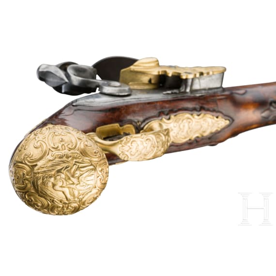 A flintlock pistol with fire-gilt mounts, circa 1720