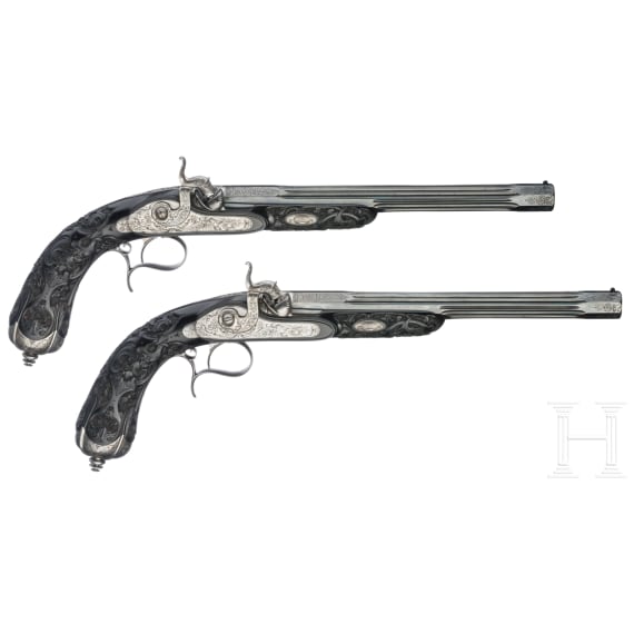 Ein hochwertiges Paar ebenholzgesch&auml;fteter Perkussionspistolen im Kasten, Paris, um 1840/50