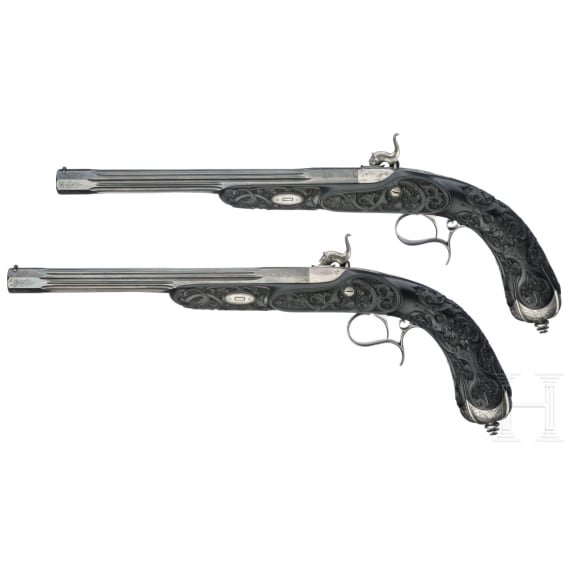 Ein hochwertiges Paar ebenholzgesch&auml;fteter Perkussionspistolen im Kasten, Paris, um 1840/50