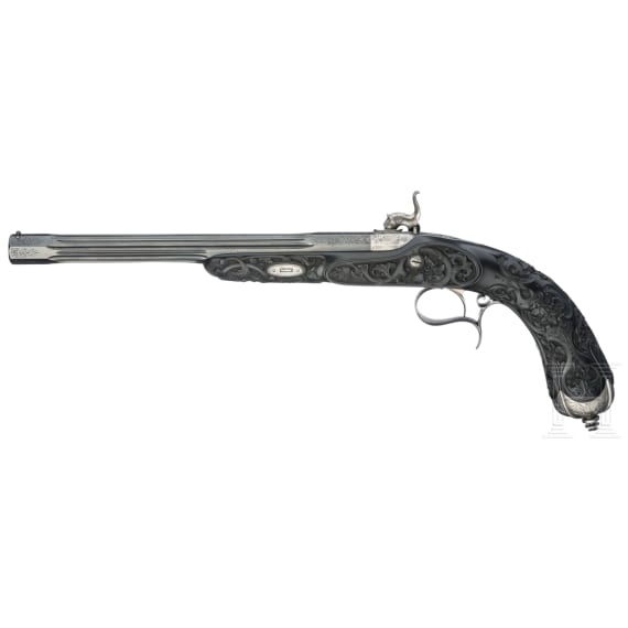 Ein hochwertiges Paar ebenholzgesch&auml;fteter Perkussionspistolen im Kasten, Paris, um 1840/50