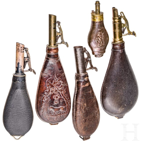 Four English shot bags and a priming powder bottle, circa 1900