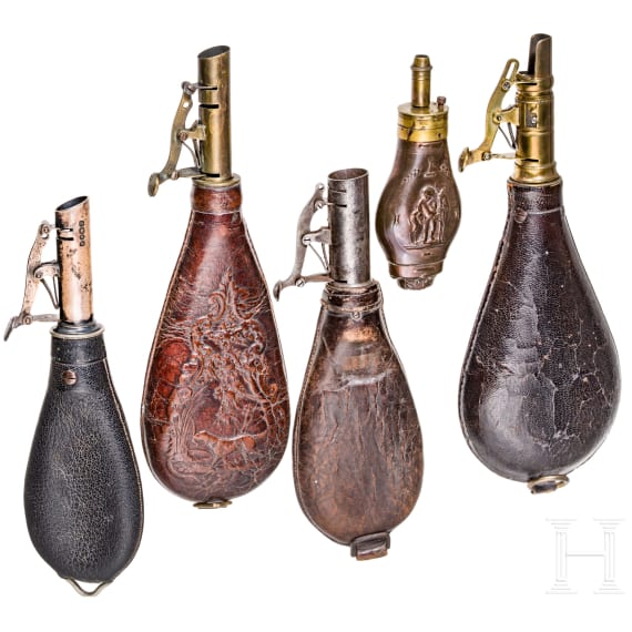 Four English shot bags and a priming powder bottle, circa 1900