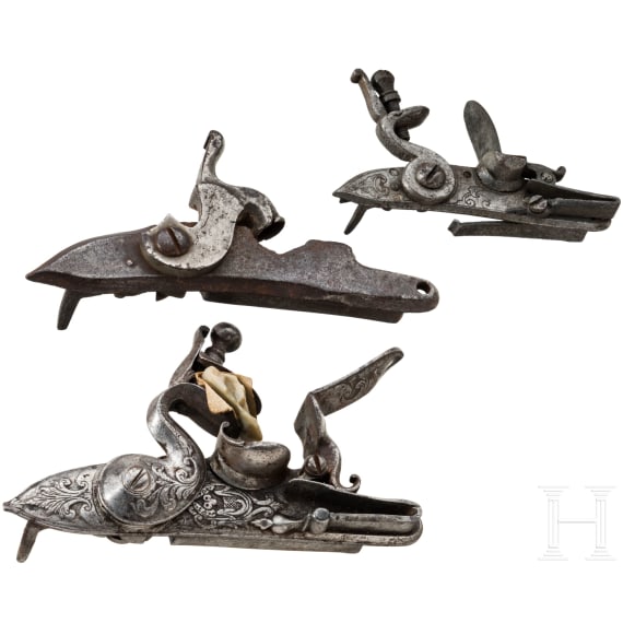 Two flintlocks and a percussion lock, 18th/19th century