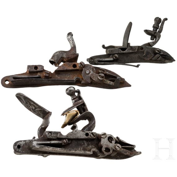 Two flintlocks and a percussion lock, 18th/19th century