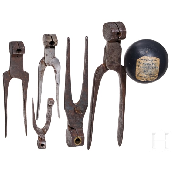Set of five bullet tongs and a cannonball, German, 18th/19th century