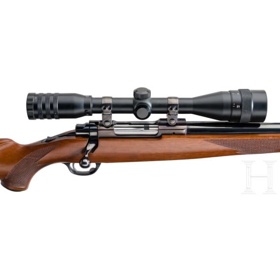 A Ruger Mod. M 77, with scope