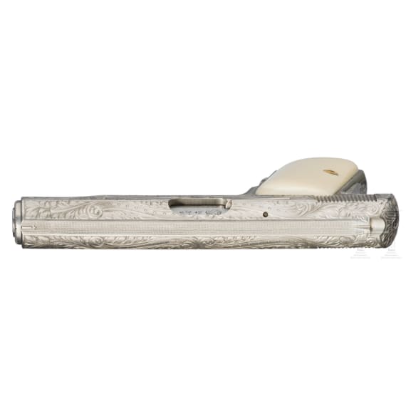 An FN Mod. 1910, factory engraved, nickel-plated, in leather case