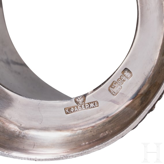 A heavy silver trompe l'oeil tea glass holder, Russia, 20th century