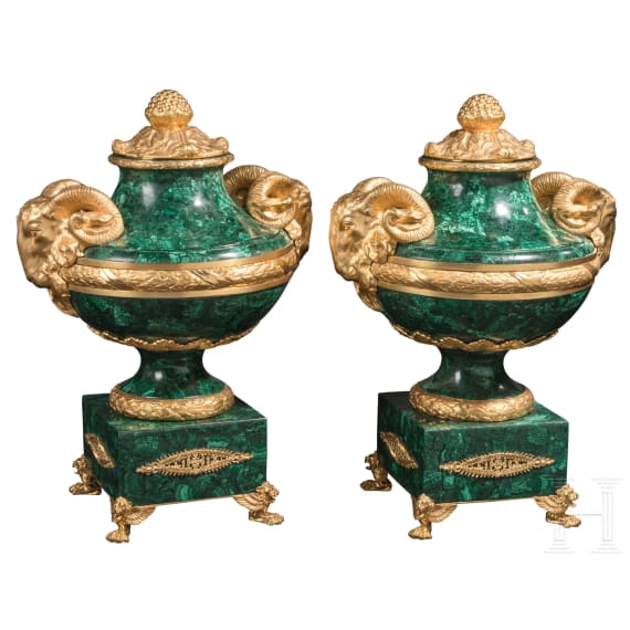 A pair of monumental malachite and ormolu-mounted vases with rams