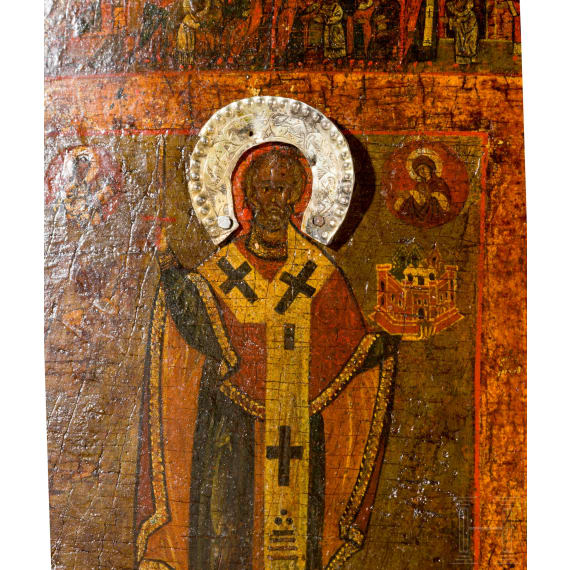 A Russian icon showing Saint Nicholas of Mozhaisk with 40 scenes of his life with silver halo, Russia, 18th century