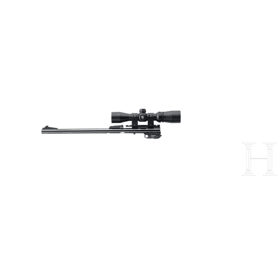 A Thompson Center Contender with receiver, stock with Tasco scope and two conversion barrels