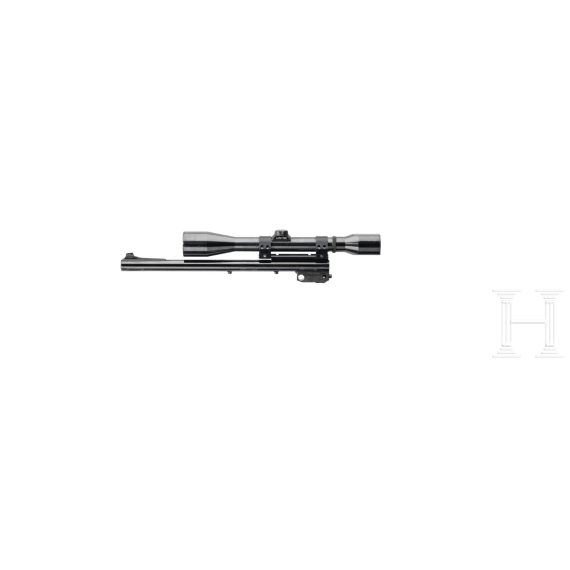 A Thompson Center Contender with receiver, stock with Tasco scope and two conversion barrels