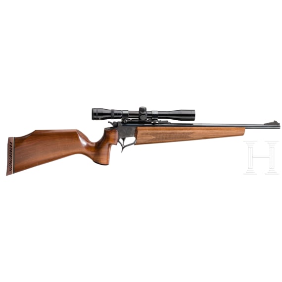 A Thompson Center Contender with receiver, stock with Tasco scope and two conversion barrels