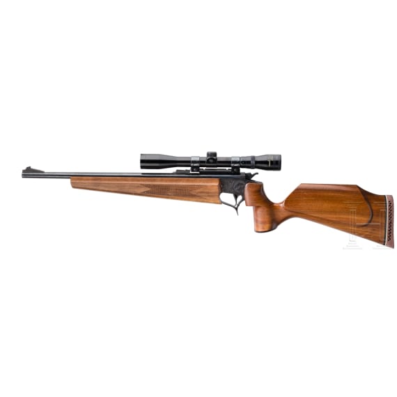 A Thompson Center Contender with receiver, stock with Tasco scope and two conversion barrels