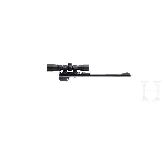 A Thompson Center Contender with receiver, stock with Tasco scope and two conversion barrels