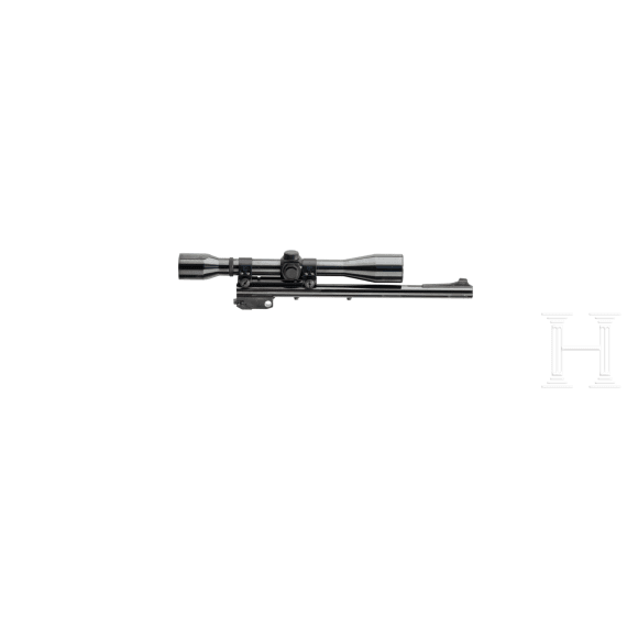 A Thompson Center Contender with receiver, stock with Tasco scope and two conversion barrels