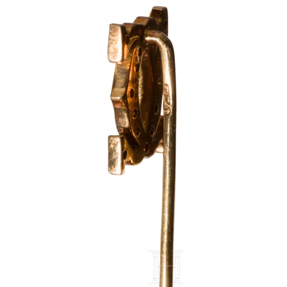 Goldene Cartier-Anstecknadel