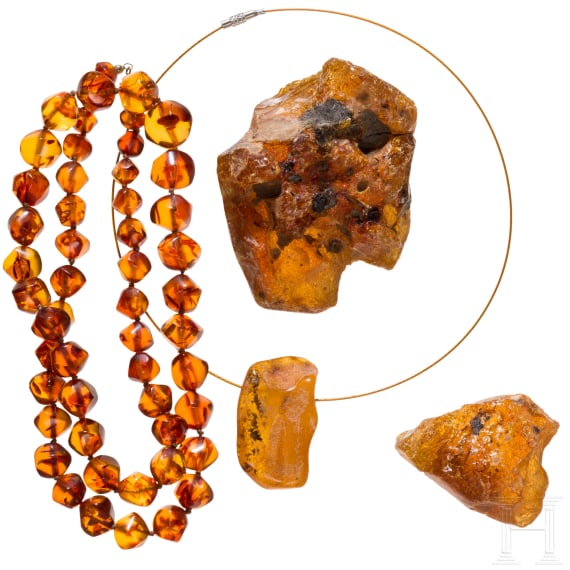 An amber necklace, an amber pendant and two amber chunks