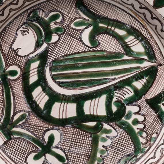 A medieval Italien earthenware plate with harpy, Orvieto (Umbria), 15th century
