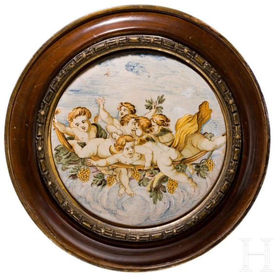 A framed Castelli Maiolica circular plate, circa 1750
