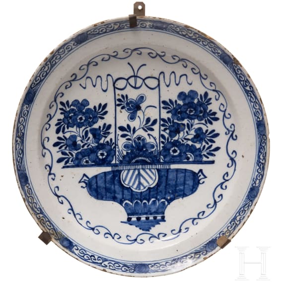 Five flower vase and swan pattern chargers, Delft, early 18th century (four) / circa 1800 (one)