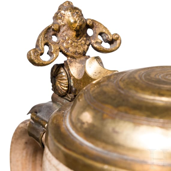 A small Westerwald stoneware jug with fire gilt lid, 17th century