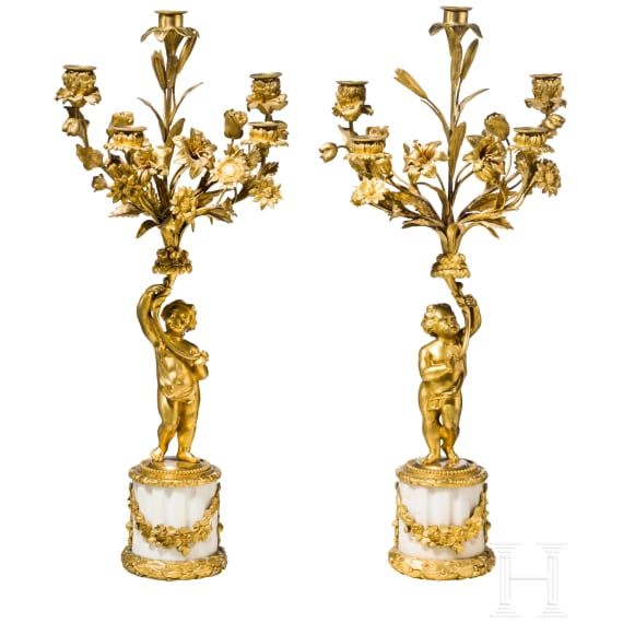 A pair of Louis XVI style five-light candelabra with putti, late 19th/early 20th century