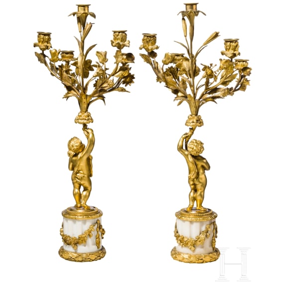 A pair of Louis XVI style five-light candelabra with putti, late 19th/early 20th century