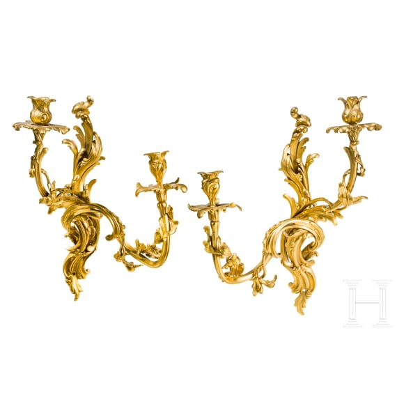 A German or French pair of fire gilt Louis XV sconces, mid-18th century