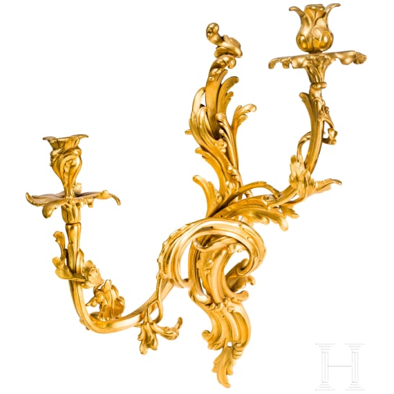 A German or French pair of fire gilt Louis XV sconces, mid-18th century