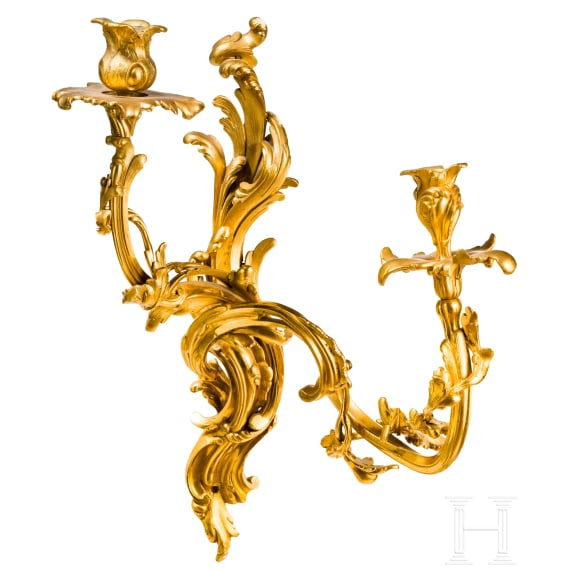 A German or French pair of fire gilt Louis XV sconces, mid-18th century