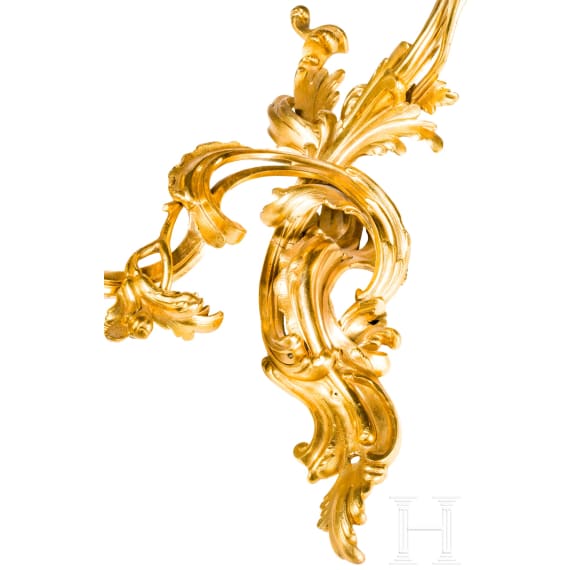 A German or French pair of fire gilt Louis XV sconces, mid-18th century