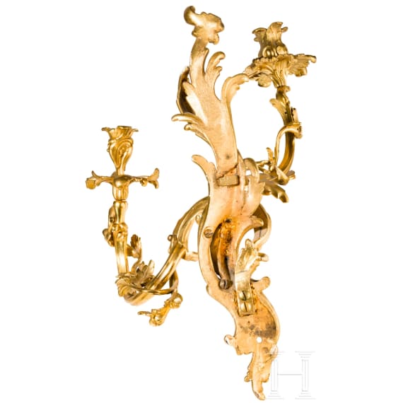 A German or French pair of fire gilt Louis XV sconces, mid-18th century