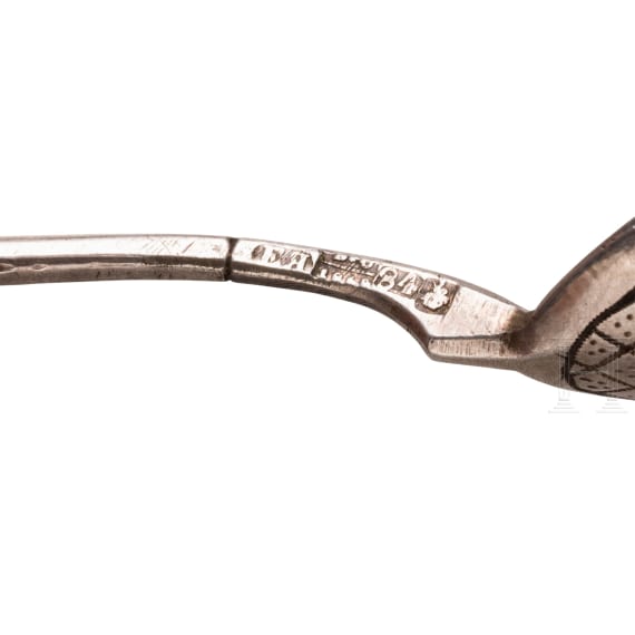 A silver sugar tongs and six spoons, Russia, 1865-1908
