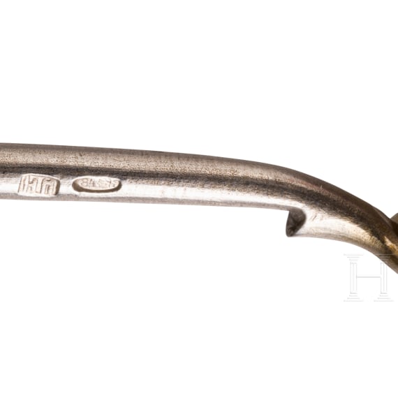 A silver sugar tongs and six spoons, Russia, 1865-1908