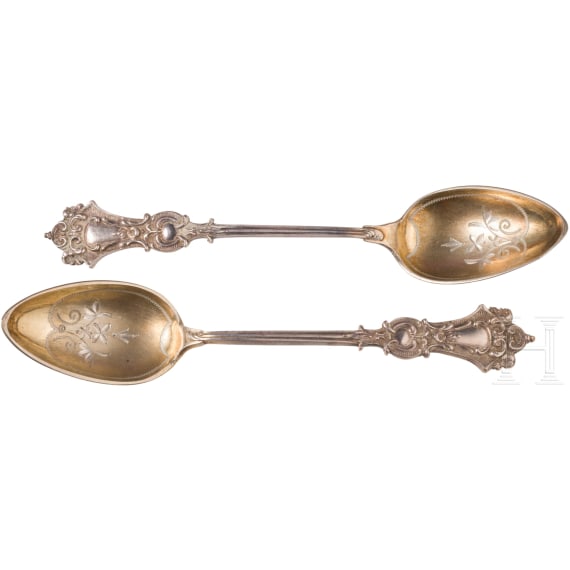 Twelve silver partial-gilt tea spoons and a sugar tong with a case, stamped Russia, circa 1880