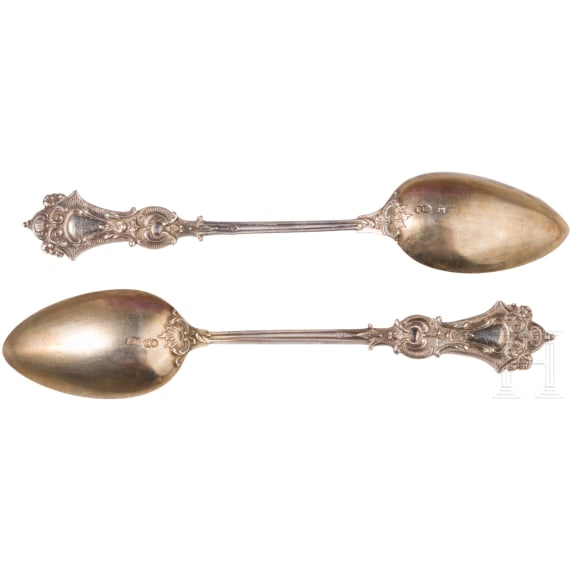 Twelve silver partial-gilt tea spoons and a sugar tong with a case, stamped Russia, circa 1880