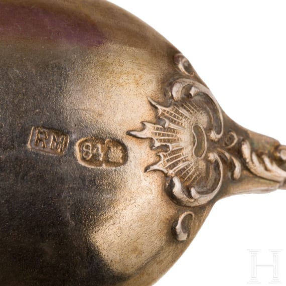 Twelve silver partial-gilt tea spoons and a sugar tong with a case, stamped Russia, circa 1880