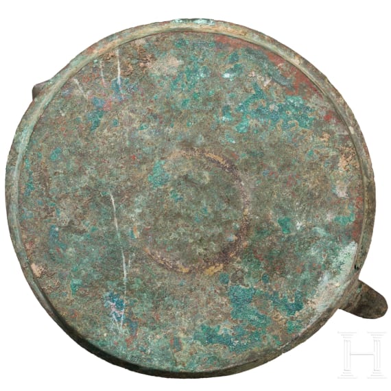 Bronze oil lamp on a disc-shaped base with floral and figurative decoration, Seljuk, 12th&ndash;13th centuries