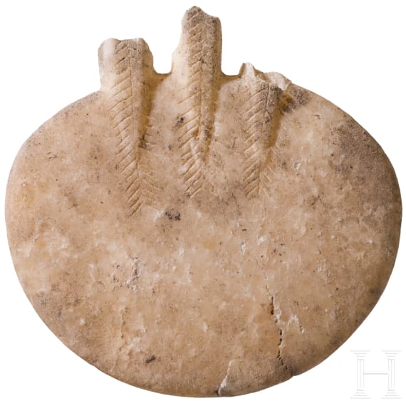 An alabaster disc decorated with incised patterns, a fragment of an Early Bronze Age idol, Cappadocia, late 3rd millennium B.C.