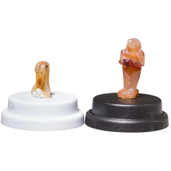 Two ancient Egyptian amulets from carnelian, depicting a cicada and the deity Nehebkau, 18th Dynasty, 16th&ndash;14th centuries B.C.