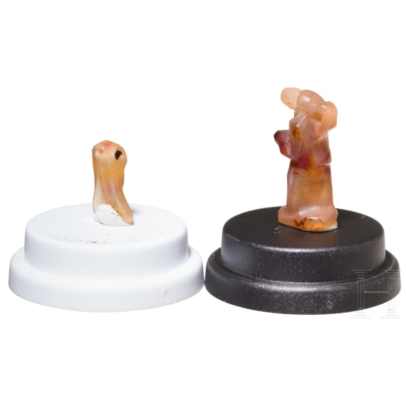 Two ancient Egyptian amulets from carnelian, depicting a cicada and the deity Nehebkau, 18th Dynasty, 16th&ndash;14th centuries B.C.