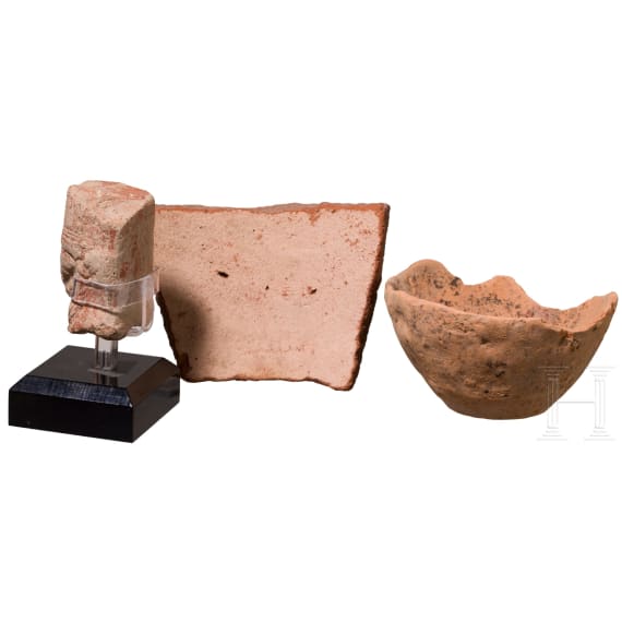 Two fragments of ancient Egyptian pottery and a clay head in Egyptian style from the eastern Mediterranean region, ca. 1350 B.C. &ndash; 6th century B.C.